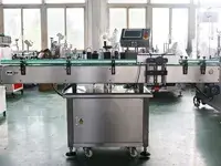 Étiqueteuse automatique de bouteilles rondes