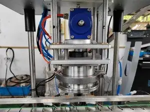 Tête de capsulage sous vide